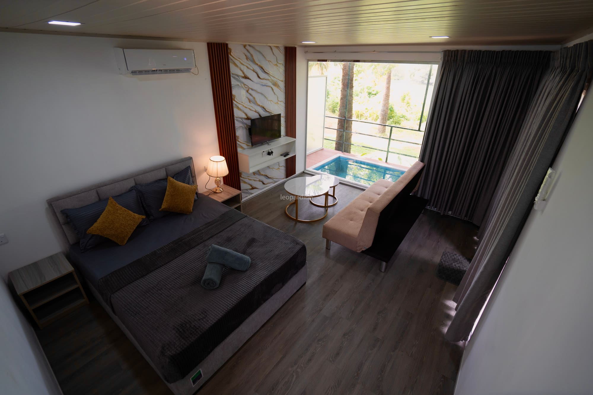 Wilpattu villa interior with private plunge pool through the window