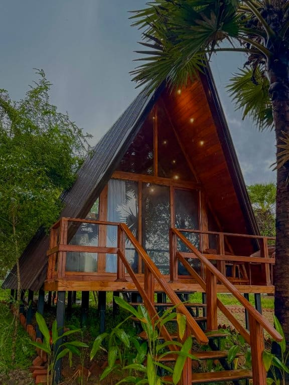 Wilpattu villa A-frame exterior lit up at dusk
